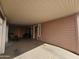 Spacious covered carport area for parking, with a nearby outdoor seating area and easy access to the home's entrance at 650 N Hawes Rd # 4508, Mesa, AZ 85207