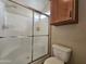 Bathroom featuring a shower with glass doors and toilet at 650 N Hawes Rd # 4508, Mesa, AZ 85207