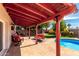 Inviting backyard showing a covered patio, patio furniture, and sparkling pool at 6707 E Aire Libre Ln, Scottsdale, AZ 85254