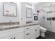 Bathroom features dual sinks, granite countertops, and a glass-enclosed shower at 6707 E Aire Libre Ln, Scottsdale, AZ 85254