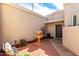 Private courtyard with a tiered fountain and a covered entryway with decorative door at 6707 E Aire Libre Ln, Scottsdale, AZ 85254