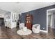 Cozy living room with dark blue accent wall, wet bar, and hardwood floors at 6707 E Aire Libre Ln, Scottsdale, AZ 85254