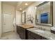 Bathroom featuring double sinks, granite countertops, and a modern design at 6993 E Soaring Eagle Way, Scottsdale, AZ 85266