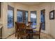 Bright breakfast nook featuring a round table, chairs, and natural light at 6993 E Soaring Eagle Way, Scottsdale, AZ 85266