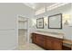 Bathroom featuring a double sink vanity, a separate room for the toilet, and a walk-in closet at 8100 E Camelback Rd # 43, Scottsdale, AZ 85251