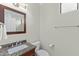 Cozy bathroom featuring a granite vanity with an integrated sink and a decorative mirror at 8100 E Camelback Rd # 43, Scottsdale, AZ 85251