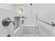 Modern bathroom featuring a step-in shower with white tile and built-in shower seat at 8100 E Camelback Rd # 43, Scottsdale, AZ 85251