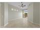 Neutral bedroom with tile floors and ceiling fan; glass block and sliding doors let in plenty of light at 8100 E Camelback Rd # 43, Scottsdale, AZ 85251