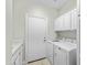 Functional laundry room with a sink, built-in cabinets, and modern washer and dryer at 8100 E Camelback Rd # 43, Scottsdale, AZ 85251