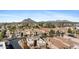 Desert homes in a golf community with desert mountain in background at 8100 E Camelback Rd # 43, Scottsdale, AZ 85251