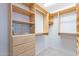 Spacious walk-in closet with custom shelving and ample storage space at 8147 E Lakeview Ave, Mesa, AZ 85209