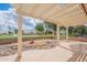 Covered patio with decorative rocks and a view of the nearby community lake and golf course at 8147 E Lakeview Ave, Mesa, AZ 85209