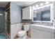 Bathroom featuring a sink, toilet, and a shower with a glass door, combining style and functionality at 921 S Val Vista Dr # 59, Mesa, AZ 85204