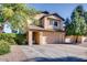 Inviting two-story home featuring a two-car garage and mature landscaping at 921 S Val Vista Dr # 59, Mesa, AZ 85204