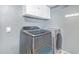 Laundry room with modern washer and dryer units, offering convenience and efficiency at 921 S Val Vista Dr # 59, Mesa, AZ 85204