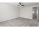 A bright bedroom with neutral paint and carpet at 9303 E Static Ave, Mesa, AZ 85212