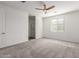 A Primary bedroom with carpet, neutral paint and view into the bathroom at 9303 E Static Ave, Mesa, AZ 85212