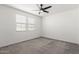 A minimalist bedroom design bathed in natural light from two windows at 9303 E Static Ave, Mesa, AZ 85212