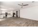 Open-concept living space with a view of the modern kitchen and tiled floors at 9303 E Static Ave, Mesa, AZ 85212