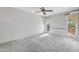 Bright bedroom with natural light from the windows, neutral carpeting, and ample space at 9817 W Loma Blanca Dr, Sun City, AZ 85351