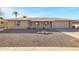 Single-story home with desert landscaping, covered front porch, and an attached two-car garage at 9817 W Loma Blanca Dr, Sun City, AZ 85351