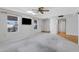 Bright living room includes a ceiling fan, skylight, and ample natural light at 9817 W Loma Blanca Dr, Sun City, AZ 85351