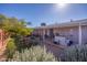 A spacious backyard with desert landscaping and a covered patio at 9834 W Evergreen Dr, Sun City, AZ 85373