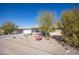 Charming single-story home features low-maintenance desert landscaping and a bright, cheerful facade on a sunny day at 9834 W Evergreen Dr, Sun City, AZ 85373