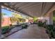 Covered patio with desert landscape, fountain, and seating area at 9834 W Evergreen Dr, Sun City, AZ 85373