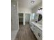 Modern bathroom showcasing dual vanities, quartz countertops, and a tiled walk-in shower at 10281 W Concordia Dr, Arizona City, AZ 85123