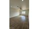 Spacious living area with ceramic wood-look tile floors, recessed lighting, and a ceiling fan at 10281 W Concordia Dr, Arizona City, AZ 85123