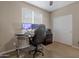 Bedroom featuring a computer desk, monitors, and a large rolling desk chair at 10778 W Whitehorn Way, Peoria, AZ 85383