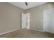 Comfortable bedroom featuring carpet flooring, neutral paint, overhead lighting, and a standard sized closet at 10778 W Whitehorn Way, Peoria, AZ 85383