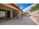 Covered back patio with red umbrella over pool offers relaxing outdoor living at 11460 E Dartmouth St, Mesa, AZ 85207