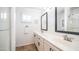 Bathroom featuring a double sink vanity with sleek, modern fixtures and a glass shower at 11460 E Dartmouth St, Mesa, AZ 85207