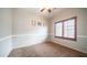 Cozy bedroom with carpet, shuttered window, and neutral paint at 11460 E Dartmouth St, Mesa, AZ 85207