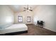 Relaxing bedroom with carpet flooring, a ceiling fan, bright windows, and high ceilings for rest and relaxation at 11460 E Dartmouth St, Mesa, AZ 85207