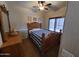 Bedroom with matching wood bed set and plush carpet flooring at 11460 E Dartmouth St, Mesa, AZ 85207