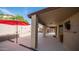 Covered patio featuring a seating area, stylish lighting, and an outdoor ceiling fan at 11460 E Dartmouth St, Mesa, AZ 85207