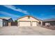 A charming home with a well manicured rock yard and spacious driveway with a two-car garage at 11460 E Dartmouth St, Mesa, AZ 85207