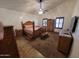 Spacious main bedroom with wood furniture and natural light from the windows at 11460 E Dartmouth St, Mesa, AZ 85207