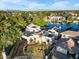 Stunning aerial view of lakefront home with solar panels and manicured landscaping at 1157 N Date Palm Dr, Gilbert, AZ 85234