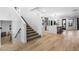 A view of the staircase and the kitchen and eating area, showing the flow of the home at 1157 N Date Palm Dr, Gilbert, AZ 85234