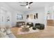 Inviting living room featuring neutral tones, a ceiling fan and a foosball table at 1157 N Date Palm Dr, Gilbert, AZ 85234