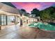 Back patio looking out on a lagoon-style pool and outdoor entertaining area at 1157 N Date Palm Dr, Gilbert, AZ 85234