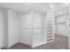 Spacious walk-in closet with custom shelves, hanging rods, and ample storage space at 1157 N Date Palm Dr, Gilbert, AZ 85234