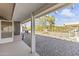 View from a covered patio looking out to an expansive backyard featuring desert landscaping at 12434 W Fieldstone Dr, Sun City West, AZ 85375