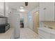 Bright laundry room with lots of storage at 12434 W Fieldstone Dr, Sun City West, AZ 85375