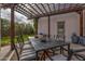 Outdoor patio space, featuring a dining table and pergola, perfect for relaxation at 1307 W Palm Ln, Phoenix, AZ 85007