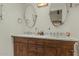 Bathroom features a marble countertop with dual sinks and a framed mirror at 1307 W Palm Ln, Phoenix, AZ 85007